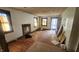 Living room with large windows, hardwood floors, and a fireplace at 2157 Sugar Grove Ave, Indianapolis, IN 46202