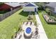Spacious backyard oasis featuring a cozy firepit, manicured lawn, and garden beds at 2325 N Talbott St, Indianapolis, IN 46205