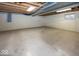 Unfinished basement with painted walls, exposed ceiling, and a window for natural light at 2325 N Talbott St, Indianapolis, IN 46205