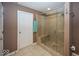 Updated bathroom featuring a glass enclosed shower with a built-in seat, tile, and modern fixtures at 2325 N Talbott St, Indianapolis, IN 46205