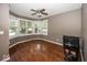 Spacious bedroom with hardwood floors, large windows, and ceiling fan offers natural light and comfortable living at 2325 N Talbott St, Indianapolis, IN 46205