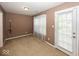 Bedroom with an outdoor access and carpet floors at 2325 N Talbott St, Indianapolis, IN 46205