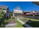 Home featuring a large upper and lower deck and garden beds in a fenced yard at 2325 N Talbott St, Indianapolis, IN 46205