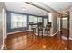Open-concept kitchen with white cabinets, dark countertops, hardwood floors, and bar seating perfect for entertaining at 2325 N Talbott St, Indianapolis, IN 46205