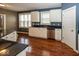 Functional kitchen with white cabinets, stainless steel appliances, and black countertops offers modern convenience at 2325 N Talbott St, Indianapolis, IN 46205