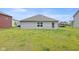 View of the home's backyard with ample green space and a neatly maintained exterior at 24416 Kercheval St, Sheridan, IN 46069
