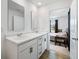 Bright bathroom featuring a double vanity with marble countertop and modern fixtures at 24416 Kercheval St, Sheridan, IN 46069