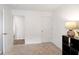 Clean bedroom with neutral walls and carpeting; open doors leading to other rooms can be seen at 24416 Kercheval St, Sheridan, IN 46069