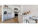 Bright kitchen with white cabinets, stainless steel appliances, an eat-in island, and barstools at 24416 Kercheval St, Sheridan, IN 46069