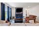 Inviting living room featuring a fireplace, comfortable seating, and large windows at 24416 Kercheval St, Sheridan, IN 46069