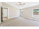 Bedroom with neutral carpet, windows, and white trim at 2895 E 600 S, Markleville, IN 46056