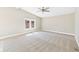 Large bedroom with neutral carpet, windows, and spacious layout at 2895 E 600 S, Markleville, IN 46056