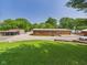 Wide view of the exterior with outbuildings, lawn, and ample parking space at 2895 E 600 S, Markleville, IN 46056