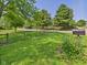 Lush front yard featuring a mailbox, mature trees, and well-maintained lawn at 2895 E 600 S, Markleville, IN 46056
