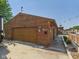 Spacious wooden garage with a large door, decorative accents, and ample parking space at 2895 E 600 S, Markleville, IN 46056