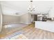 Inviting living room with modern flooring, a ceiling fan, and open access to kitchen at 2895 E 600 S, Markleville, IN 46056