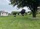 Expansive lawn featuring mature trees and an outbuilding at 2925 Morgan Trl, Martinsville, IN 46151