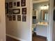 Bathroom with a vanity and framed art/memorabilia on the hallway wall outside the doorway at 2925 Morgan Trl, Martinsville, IN 46151