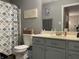 Cozy bathroom featuring a patterned shower curtain, a basket of towels, and modern fixtures at 2925 Morgan Trl, Martinsville, IN 46151