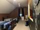Cozy bedroom with twin beds, chalk-painted walls, a ceiling fan, and natural light at 2925 Morgan Trl, Martinsville, IN 46151