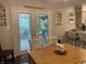 Bright dining area with a view of the backyard through french doors at 2925 Morgan Trl, Martinsville, IN 46151