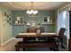 Inviting dining room with a dark wooden table, charming decor, and lots of natural light at 2925 Morgan Trl, Martinsville, IN 46151
