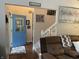 Welcoming entryway with a bright blue front door, hardwood floors and staircase at 2925 Morgan Trl, Martinsville, IN 46151