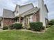 Traditional home exterior with mature landscaping, brick accents, and natural light at 2925 Morgan Trl, Martinsville, IN 46151