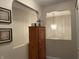 Hallway with an ornate cabinet placed between two arched shelving areas at 2925 Morgan Trl, Martinsville, IN 46151