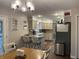 Bright kitchen with stainless steel appliances, bar seating, and an adjacent dining area at 2925 Morgan Trl, Martinsville, IN 46151