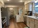 Modern kitchen with stainless steel appliances and a seamless flow into the dining area at 2925 Morgan Trl, Martinsville, IN 46151