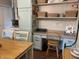 A cozy kitchen with a built in desk, cabinets, and a wooden dining table at 2925 Morgan Trl, Martinsville, IN 46151