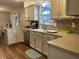 Cozy kitchen with stainless appliances, tiled backsplash, and a view into the dining area at 2925 Morgan Trl, Martinsville, IN 46151