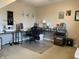 Home office setup with desk, sewing machine and computer, offering a workspace with organized storage at 2925 Morgan Trl, Martinsville, IN 46151