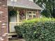 Charming front porch with hanging floral baskets and a well-maintained landscape at 2925 Morgan Trl, Martinsville, IN 46151