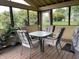 Inviting screened porch with comfortable seating, perfect for enjoying the outdoors at 2925 Morgan Trl, Martinsville, IN 46151