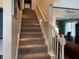 Carpeted staircase with white trim, leading to the upper level of the home at 2925 Morgan Trl, Martinsville, IN 46151