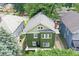 Aerial view of the green two-story home showing roof, yard, and neighborhood at 3307 N College Ave, Indianapolis, IN 46205