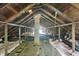 Unfinished attic with exposed rafters, brick chimney, insulation, and evidence of wiring at 3307 N College Ave, Indianapolis, IN 46205