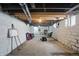Unfinished basement with painted concrete walls and visible ceiling and systems at 3307 N College Ave, Indianapolis, IN 46205
