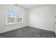 This bright bedroom has fresh neutral paint, updated carpet, and a large window at 3307 N College Ave, Indianapolis, IN 46205