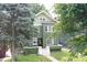 Two-story green home with many trees at 3307 N College Ave, Indianapolis, IN 46205