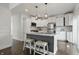Well-lit kitchen with white cabinetry, stainless steel appliances, and a stylish island at 3307 N College Ave, Indianapolis, IN 46205