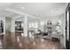 Open concept living area with hardwood floors, lots of light, and a fireplace at 3307 N College Ave, Indianapolis, IN 46205
