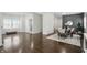 Bright living space featuring hardwood floors and an adjacent dining area, perfect for entertaining at 3307 N College Ave, Indianapolis, IN 46205