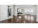 Spacious living room with open floor plan, bathroom view and hardwood floors, ideal for relaxation at 3307 N College Ave, Indianapolis, IN 46205