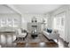 Bright living room with hardwood floors, a fireplace, and neutral colored furnishings at 3307 N College Ave, Indianapolis, IN 46205