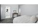 Inviting main bedroom with plush carpet, a decorative table, and neutral tones at 3307 N College Ave, Indianapolis, IN 46205