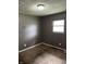 Modest bedroom featuring neutral carpet, a single window, and standard electrical outlets, ready for comfortable living at 3320 E 26Th St, Indianapolis, IN 46218