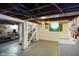 Unfinished basement featuring laundry area, painted walls and open ceiling with exposed ductwork at 3329 Main St, Anderson, IN 46013